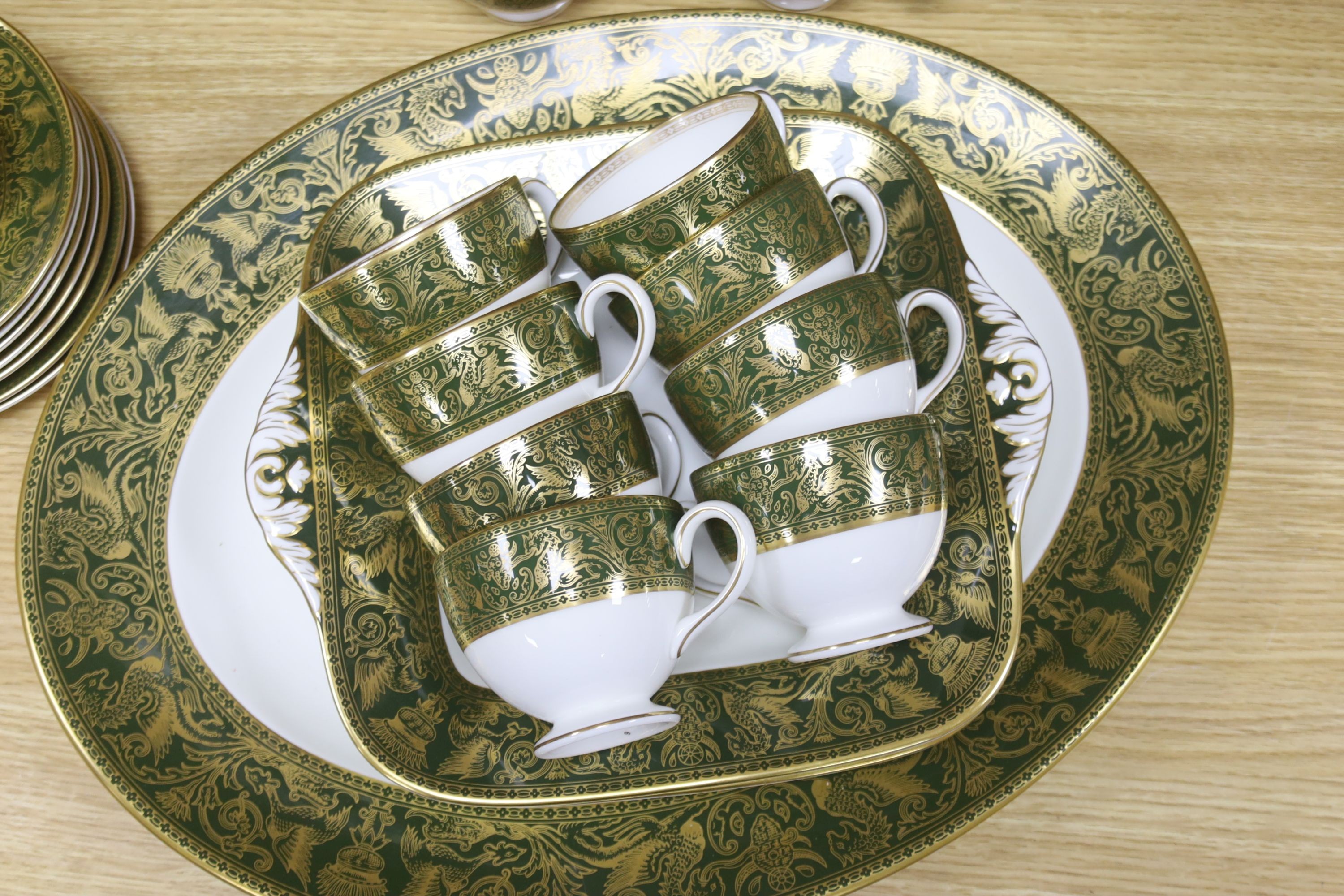 A Wedgwood Green Florentine pattern bone china part dinner and tea service, 110 pieces for a 12 place setting